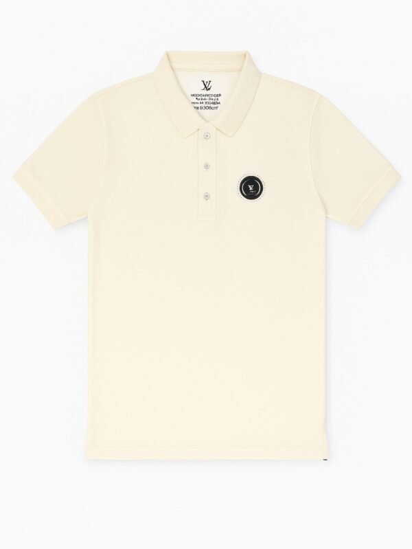 Cream-colored short-sleeve polo shirt with three-button placket and black circular embroidered chest logo on a white background.